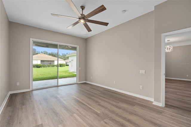 unfurnished room featuring ceiling fan and light hardwood / wood-style flooring