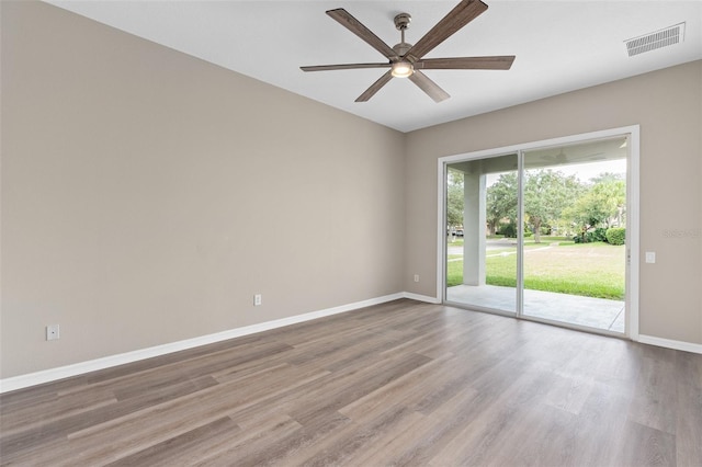 empty room featuring hardwood / wood-style floors and ceiling fan