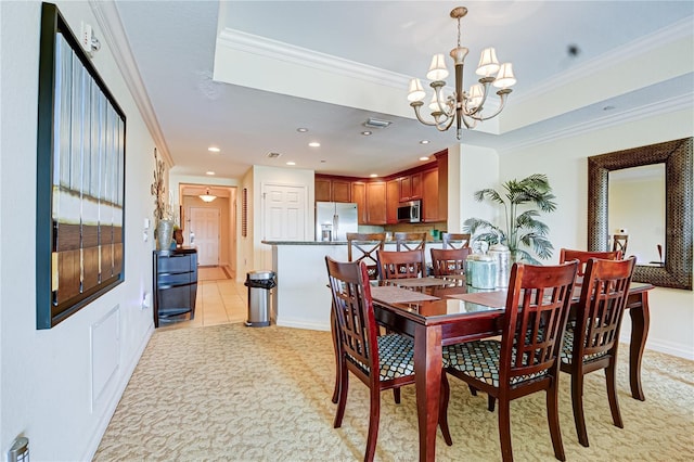 dining area featuring crown molding, a chandelier, and light tile patterned floors