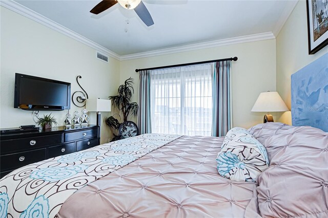 bedroom with ornamental molding and ceiling fan