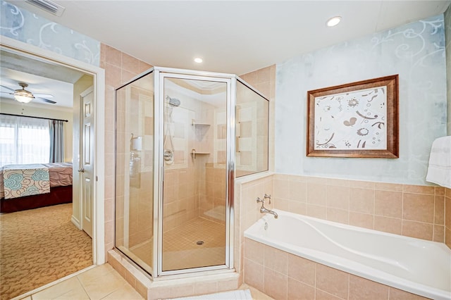 bathroom with ceiling fan, tile patterned floors, and plus walk in shower