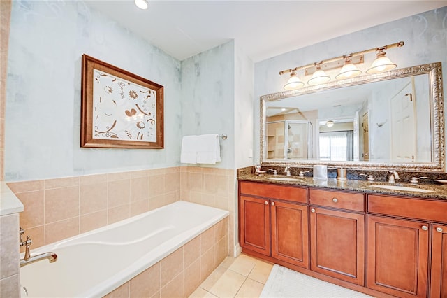 bathroom featuring vanity, shower with separate bathtub, and tile patterned flooring