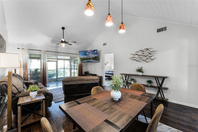 dining room with ceiling fan, ornamental molding, dark wood-type flooring, and wood ceiling