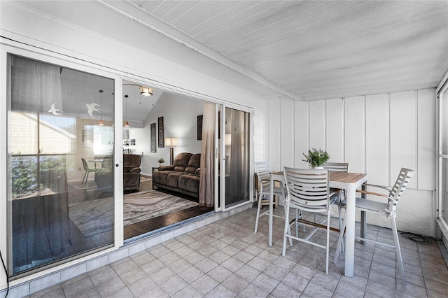 sunroom / solarium with vaulted ceiling