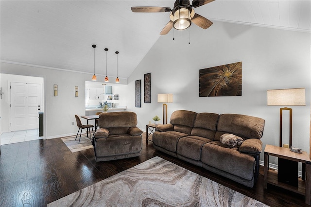 living room with ceiling fan, wood-type flooring, ornamental molding, and high vaulted ceiling