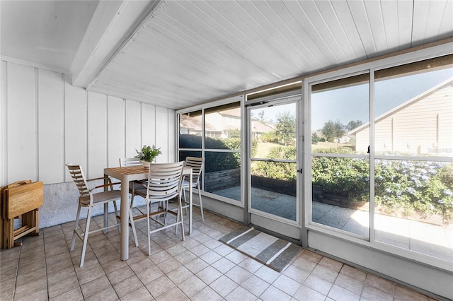 sunroom / solarium with a wealth of natural light and wood ceiling