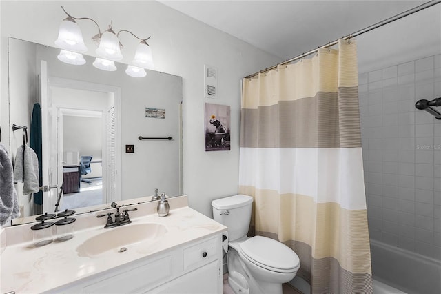 full bathroom featuring shower / bath combo, vanity, and toilet