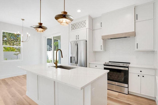 kitchen featuring plenty of natural light, a kitchen island with sink, sink, and stainless steel appliances