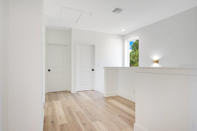 spare room with light hardwood / wood-style flooring