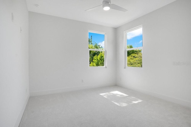 empty room featuring ceiling fan and carpet flooring