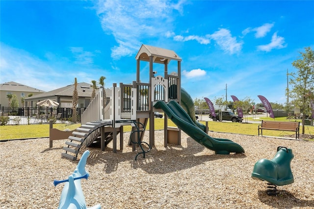 view of jungle gym with a lawn