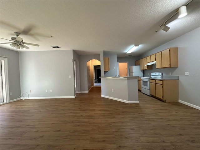 kitchen with a textured ceiling, dark hardwood / wood-style floors, and white appliances