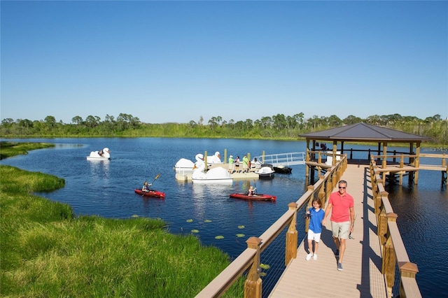 view of dock featuring a water view and a gazebo