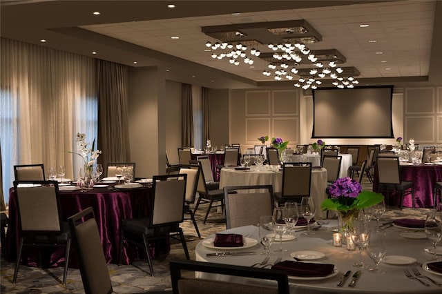 dining space with a drop ceiling