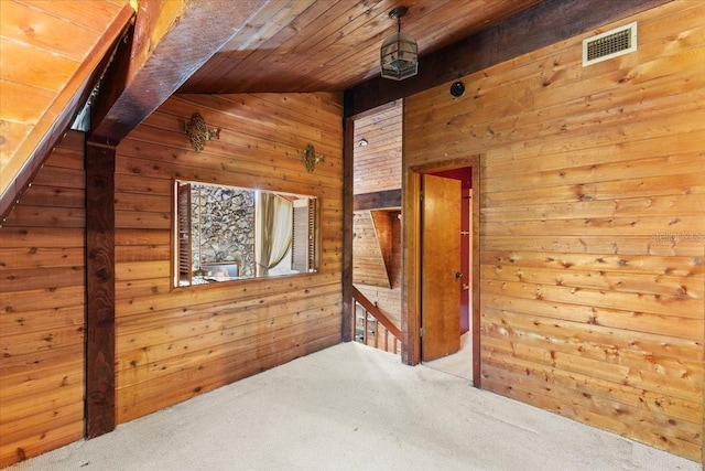 bonus room featuring wood walls, carpet, vaulted ceiling, and wooden ceiling