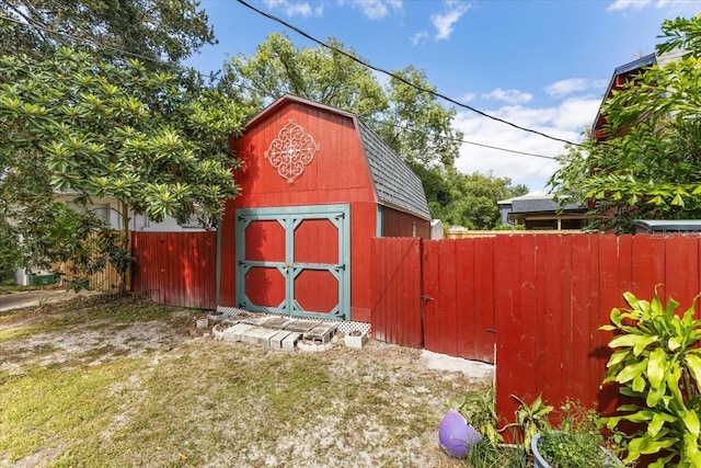 view of outbuilding featuring a yard