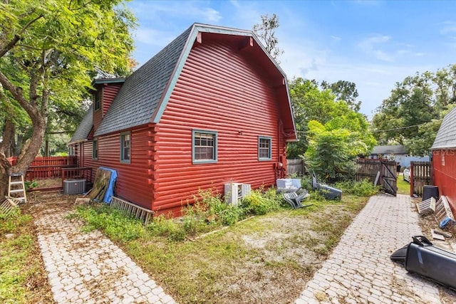 view of side of property featuring central AC