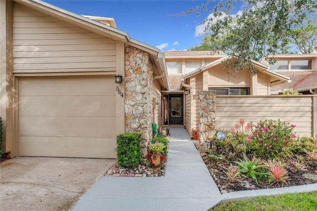 view of exterior entry with a garage