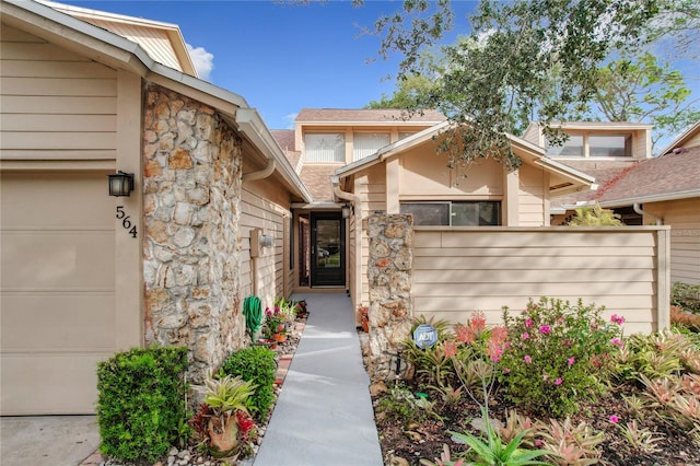 view of exterior entry featuring a garage