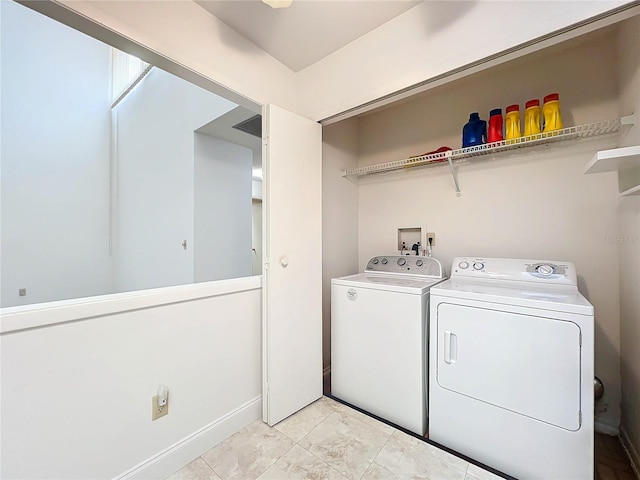 washroom featuring independent washer and dryer