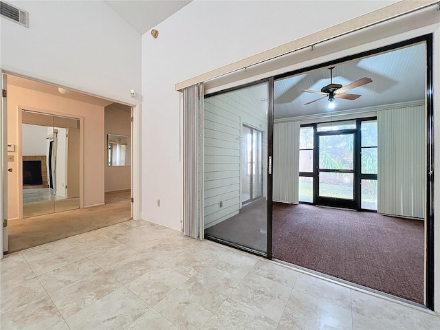 carpeted spare room featuring ornamental molding and ceiling fan