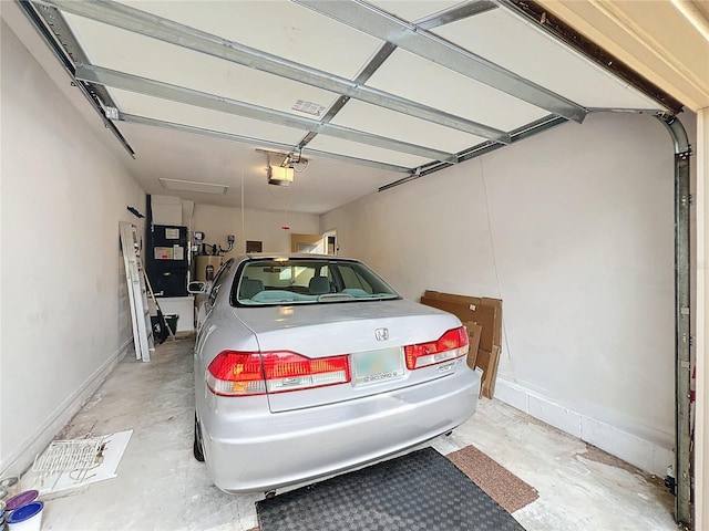 garage with a carport, a garage door opener, heating unit, and water heater