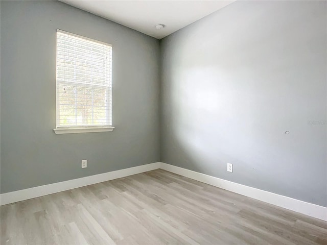 unfurnished room with light wood-type flooring