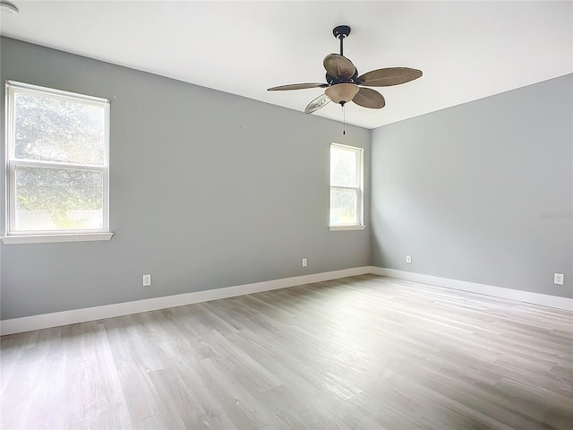 unfurnished room featuring light hardwood / wood-style flooring and ceiling fan