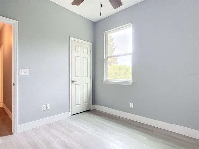 unfurnished bedroom featuring ceiling fan and light hardwood / wood-style flooring