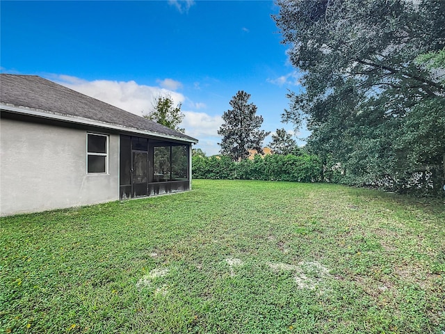 view of yard with a sunroom