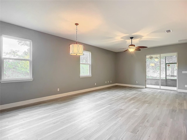 unfurnished room with ceiling fan and light hardwood / wood-style flooring