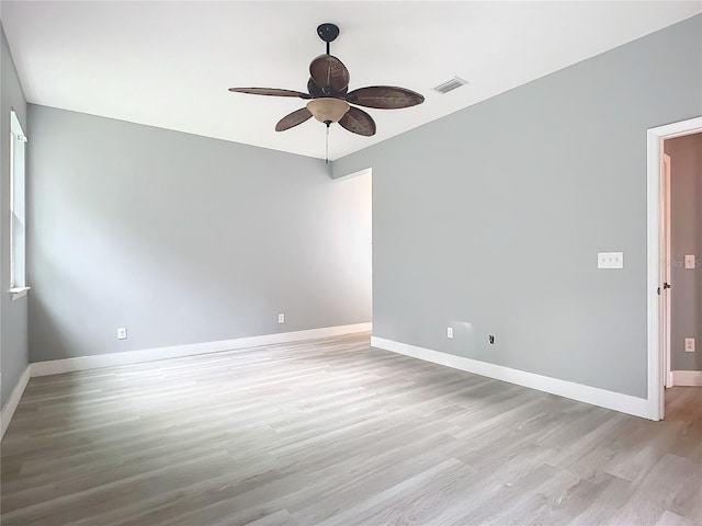 unfurnished room featuring light hardwood / wood-style flooring and ceiling fan