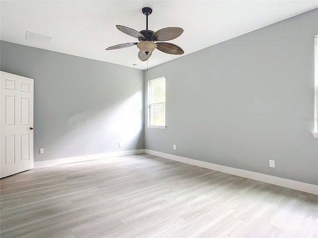 spare room with ceiling fan and light wood-type flooring