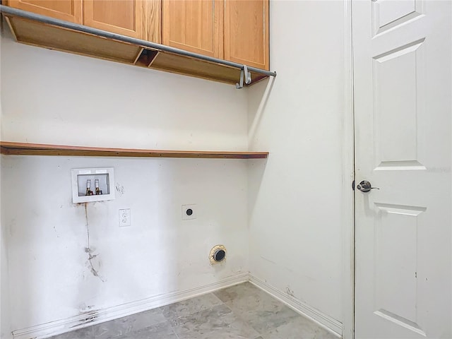 clothes washing area featuring cabinets, hookup for an electric dryer, and washer hookup