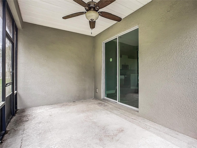 unfurnished sunroom with wood ceiling and ceiling fan