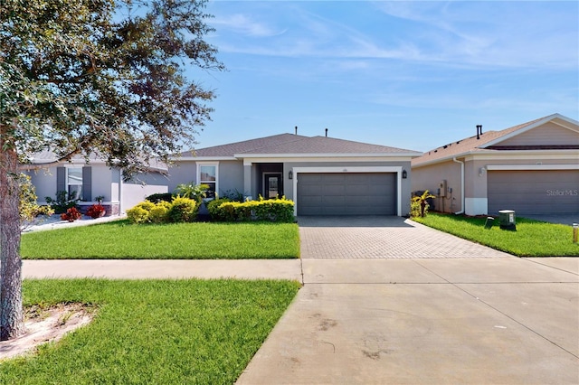 ranch-style home with a front yard and a garage