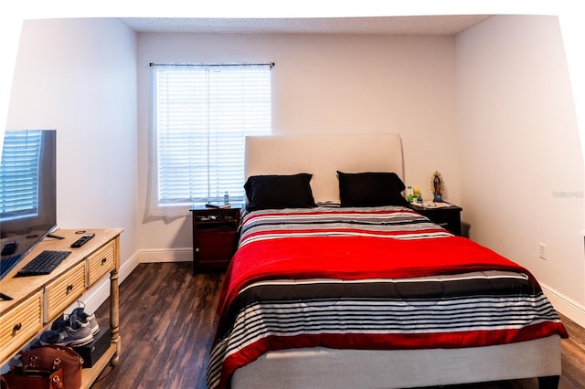 bedroom featuring dark wood-type flooring