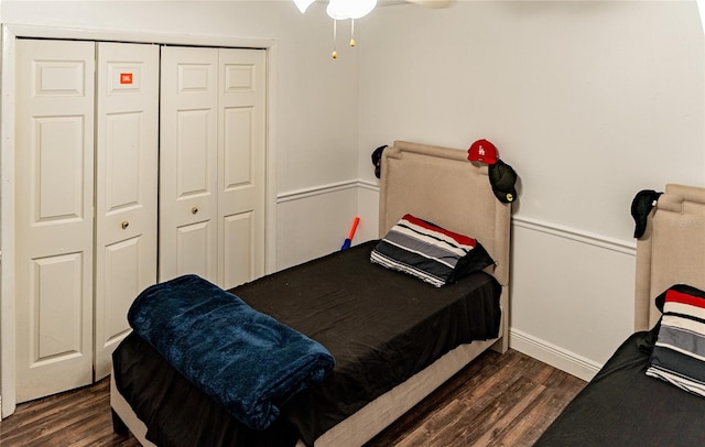 bedroom with a closet and dark hardwood / wood-style floors