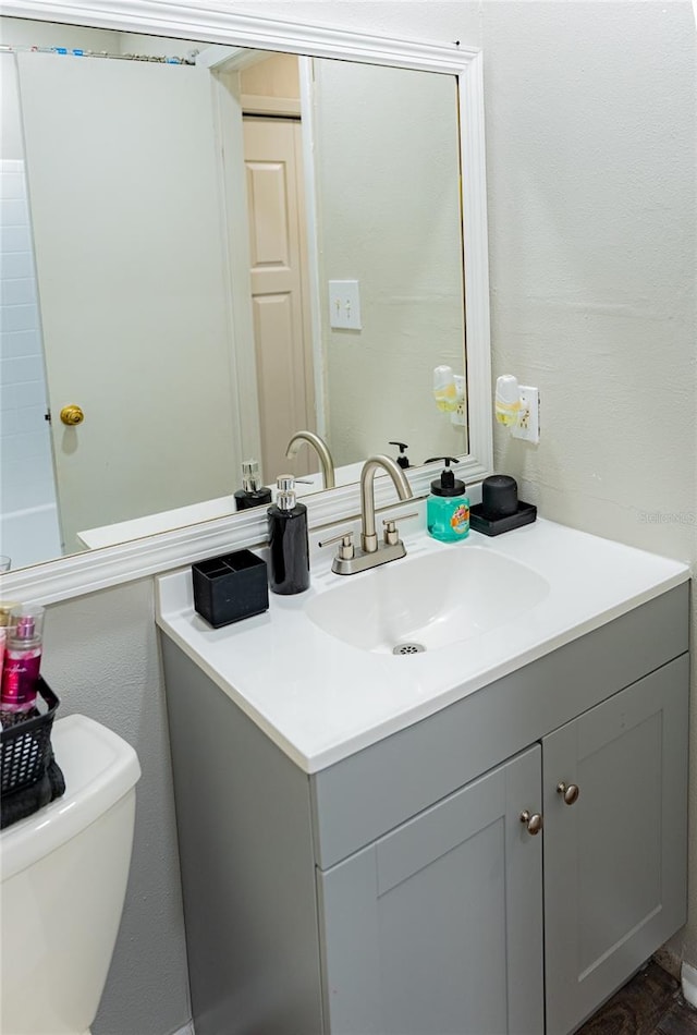 bathroom with vanity and toilet