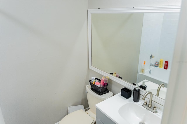 full bathroom featuring bathing tub / shower combination, vanity, and toilet