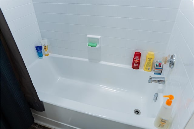 bathroom featuring shower / bath combination with curtain