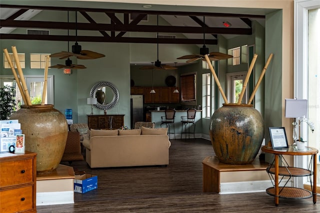 living room featuring high vaulted ceiling, beam ceiling, and dark hardwood / wood-style floors