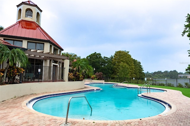 view of swimming pool with a patio area