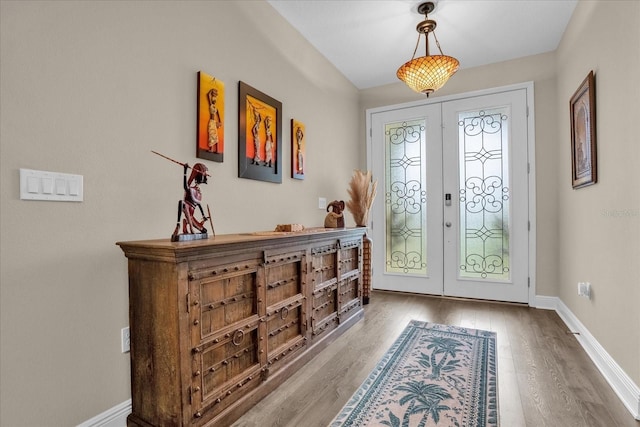 entryway with french doors and hardwood / wood-style flooring