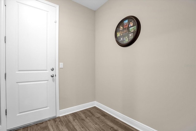 doorway to outside with wood-type flooring