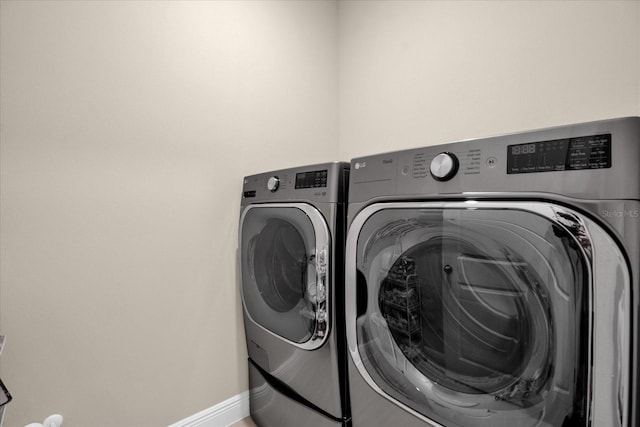 laundry room featuring washer and clothes dryer