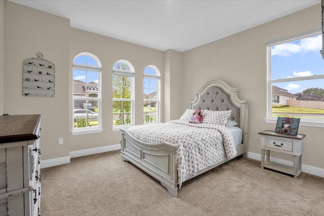 bedroom with light colored carpet