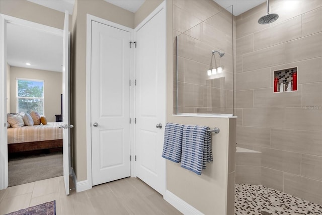 bathroom with tiled shower