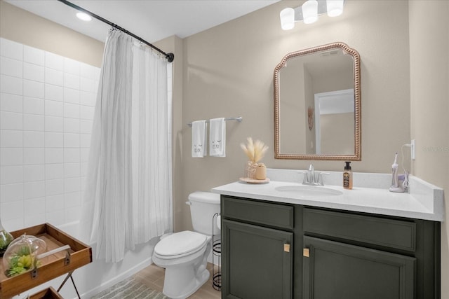 full bathroom with shower / tub combo, tile patterned flooring, toilet, and vanity