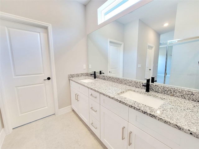 bathroom with vanity and an enclosed shower